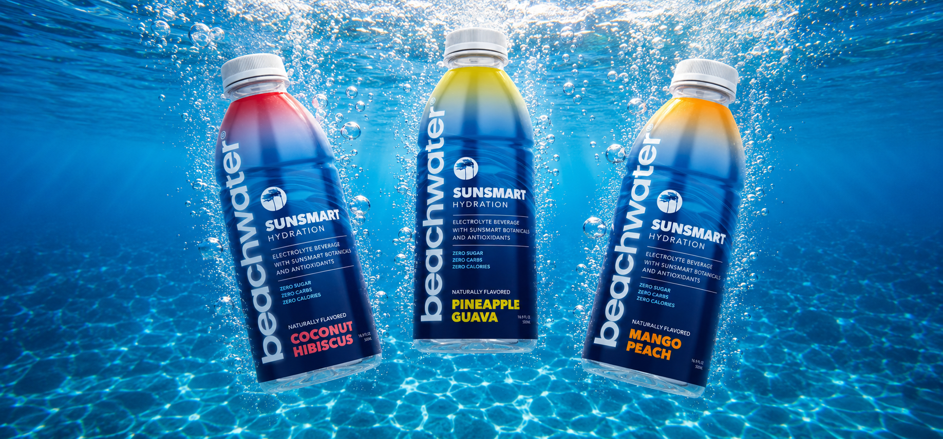 Beachwater bottles splashing into ocean water